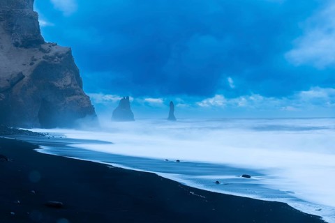 Reynisdrangar pinnacles, lava sandy beach, lava rocks, sea, waves, surf, blue hour, Vik, Iceland,