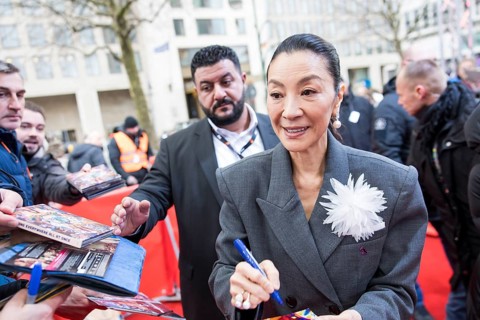 Michelle Yeoh signs autographs ahead of the premiere of the film Everything Everywhere All At Once