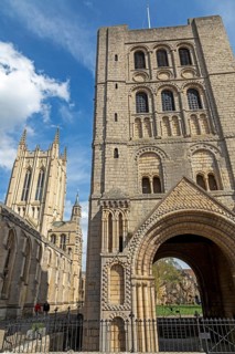 Norman tower, also called church gate, behind it St Edmundsbury Cathedral, Bury St Edmunds, West