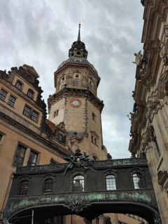 Historic clock tower, Hausmannsturm with a view of the residential palace's cabinet bridge against