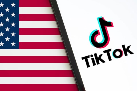 TikTok is preparing for a shutdown in the US. Tiktok logo is displayed on Ipad and USA flag in the