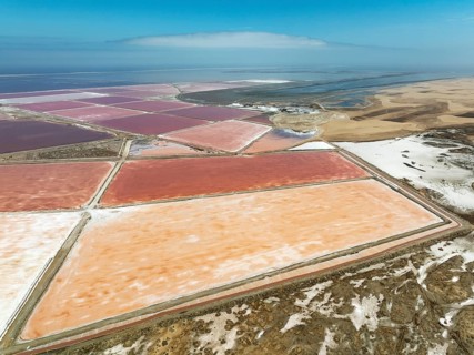 Saline ponds at the salt works of Walvis Bay Salt adjoining the Walvis Bay lagoon and the dunes of