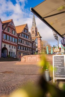 Historic city center with half-timbered houses and church in sunny weather, Calw, Black Forest,
