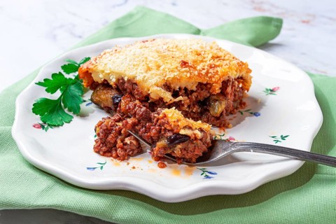 Sliced moussaka, Greek dish, baked eggplant with minced meat, with bechamel sauce, home cooking