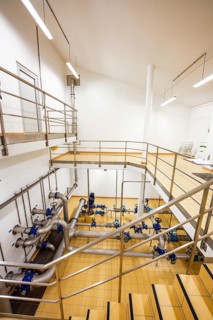 Open staircase with metal railings and visible pipe systems, ENCW Netze Calw waterworks, Calw,