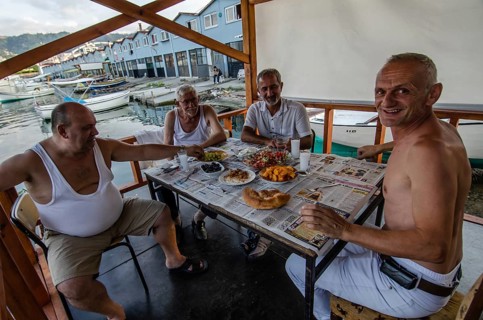 Trabzon, Turkey. 6th September 2014 Turkish fishermen enjoy a traditional Mezze with Raki in the