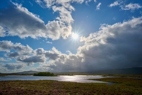 Sunbeams through big clouds, river landscape with mountains in the background, Rannoch Moor, Bridge