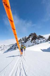 Ski tourer with rope, rope team on the Vadret da Porchabella glacier on the ascent to the summit of