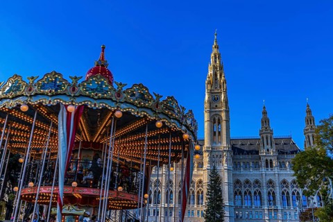 Children's carousel at the Christmas market at City Hall, behind the City Hall, Vienna, Austria