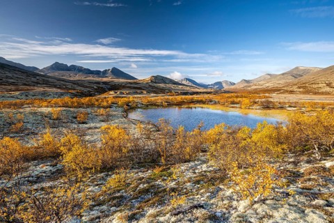 Autumn landscape in Rondane National Park, mountains Høgronden, Midtronden and Digerronden Dørålen,