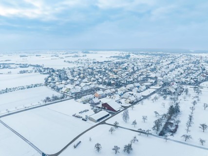 Landscape with snow-covered village and neighbouring agricultural land, Deckenpfronn, Böblingen