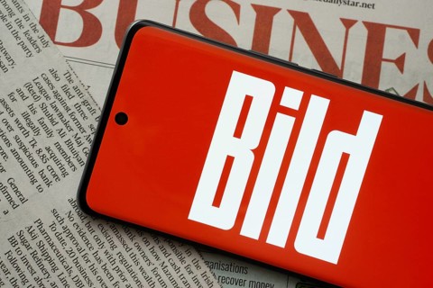 The logo of the German newspaper Bild is displayed on a smartphone screen