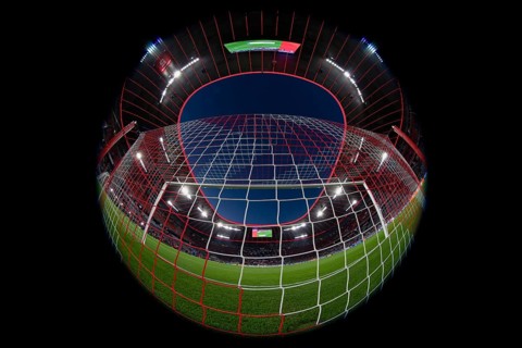 Overview, interior, floodlit match, behind-the-goal perspective, goal net, blue hour, fisheye shot,