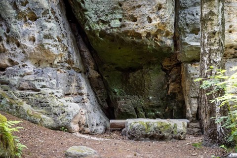 Bench with table in a small natural sandstone cave on the way to Kleiner Bärenstein, Saxon