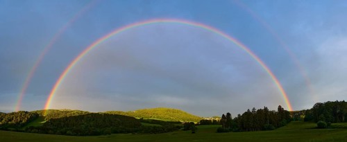 Rainbow in a hilly landscape with forest, Bavarian Forest, Bavaria, Germany