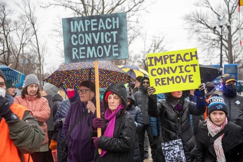 Detroit, Michigan USA - 13 January 2026 - Hundreds of protesters rallied in the rain outside the