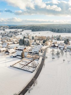 Rural winter landscape with snow-covered houses and streets, Oberreichenbach, Black Forest, Calw