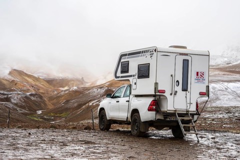 4x4 camper van, early snow, Hveradalir geothermal area, Kerlingarfjöll, Icelandic highlands,