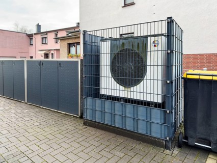 Heat pump behind a fence in Hilden, Germany