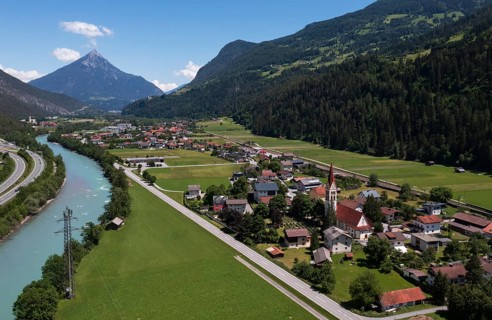 Drone shot, view of village with parish church, Schönwies, Inn, Oberinntal, Tyrol, Austria