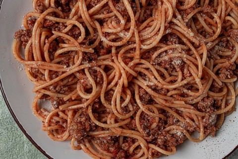 Spaghetti bolognese, in a frying pan, top view, homemade, no people