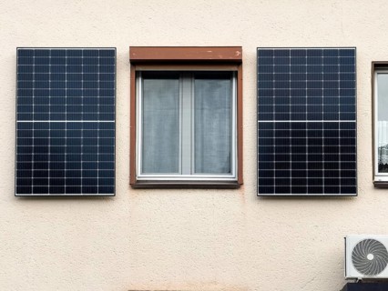 Two solar panels on the façade of an apartment block in Hilden, Germany