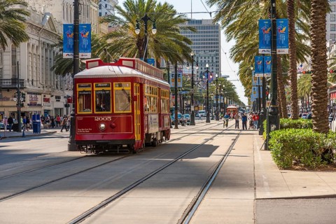 Electric streetcar on Canal Street in downtown New Orleans, Louisiana, USA
