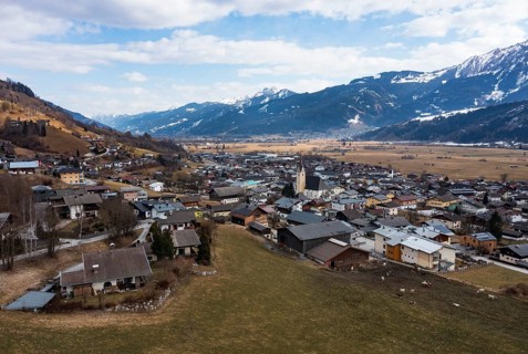 Drone shot, view of village with parish church, Piesendorf, Pinzgau, Salzburg province, Austria