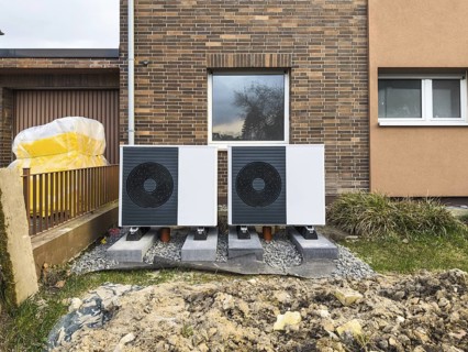 2 heat pumps are installed on an apartment block in a front garden, Hilden, Germany