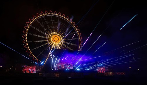 Night shot, rehearsal for New Year's Eve party, theatre, laser show, light show, Ferris wheel,