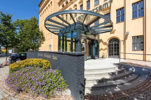 Former porcelain factory, today district administration office, entrance area with lettering