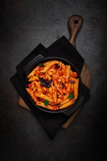 Penne pasta, with shrimp in tomato sauce, close-up, no people