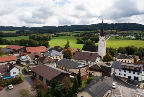 Drone shot, view of village with church, Sankt Marienkirchen am Hausruck, Hausruckviertel, Upper