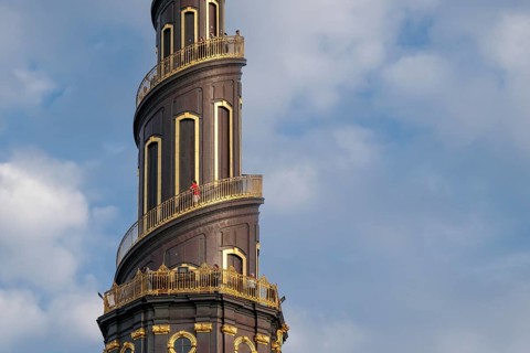 Detail of the corkscrew-shaped tower of the Evangelical Lutheran Church of the Saviour, in front of