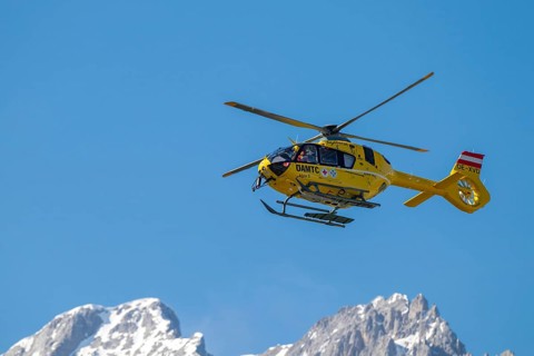 Rescue helicopter, emergency helicopter in flight, Schwaz, Tyrol, Austria