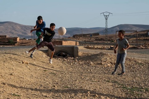 Taouloukoult, MOROCCO - OCTOBER 6, 2024: young boys spend the afternoon playing amateur football on