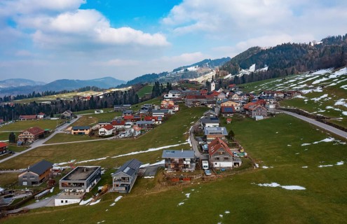 Drone image, residential buildings, settlement area, parish church, Riefensberg, Bregenzerwald,