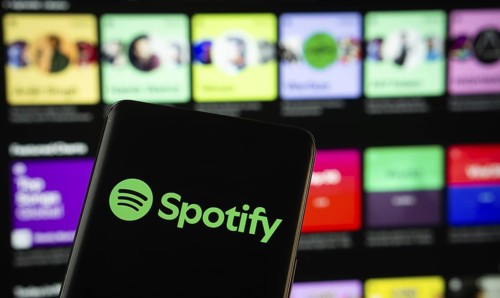 Dhaka, Bangladesh - 18 March 2025: The logo of the spotify is displayed on a smartphone screen, and