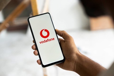 Vodafone logo is displayed on smartphone.