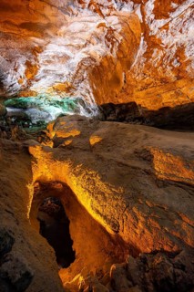 Underground cave formed by lava flow, illuminated lava tunnel, Cueva de los Verdes, Lanzarote,