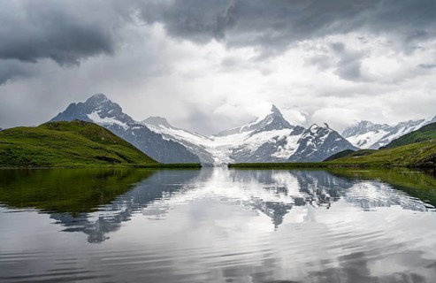 Mittelhorn and Schreckhorn peaks with Upper Grindelwald glacier are reflected in the Bachalpsee