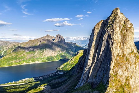 Aerial view of Mt. Segla, in the back Mt. Breidtinden, Senja Island, Norway