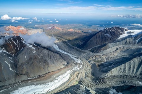 Glacier bed and colored mountains, aerial view, Alaska Range, Denali National Park, Alaska, USA