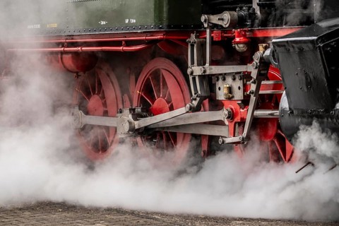 Detailed view of the drive wheels and coupling rods of a steam locomotive, Bochum railway museum,