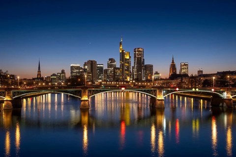 The lights of Frankfurt's banking skyline glow in the evening, Frankfurt am Main, Hesse, Germany
