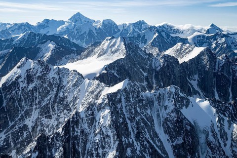 Snow and ice, epic mountains with glaciers, aerial view, Alaska Range, Denali National Park,