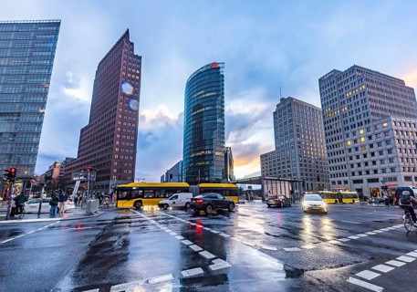 Potsdamer Platz Berlin in the evening with traffic on the streets. When it rains, the skyscrapers