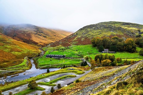 Autumn colors over Claerwen Dam, Claerwen Valley, Elan Valley Reservoir, Rhayader, Powys, Wales, UK