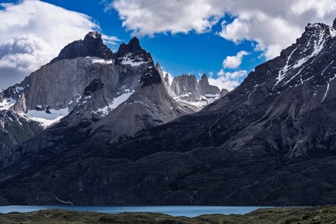 Granite peaks of Cuernos del Paine with remnants of snow, Torres del Paine behind, in front of the