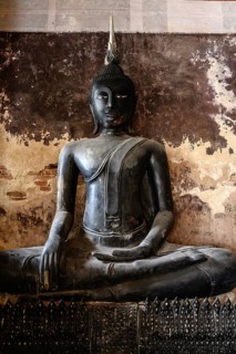 Bangkok, Thailand. February 20th 2025. A black Buddha statue on display in the The Wat Suthat